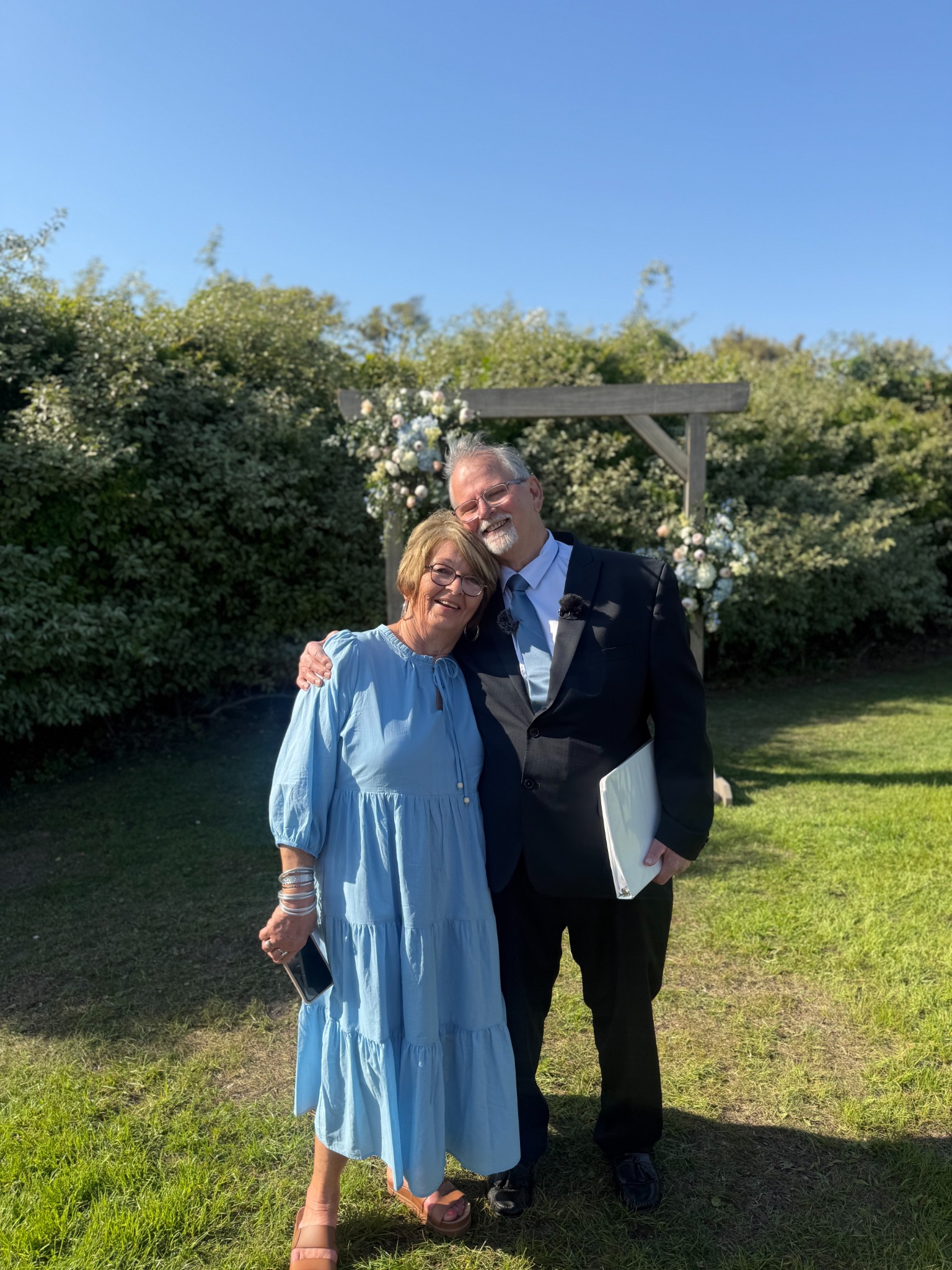 Pastor Tom and Terry smiling together outdoors